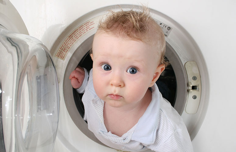 child in washing machine